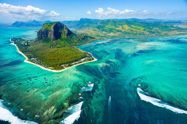 Aerial view of Mauritius island panorama and famous Le Morne Brabant mountain, beautiful blue lagoon and underwater waterfall