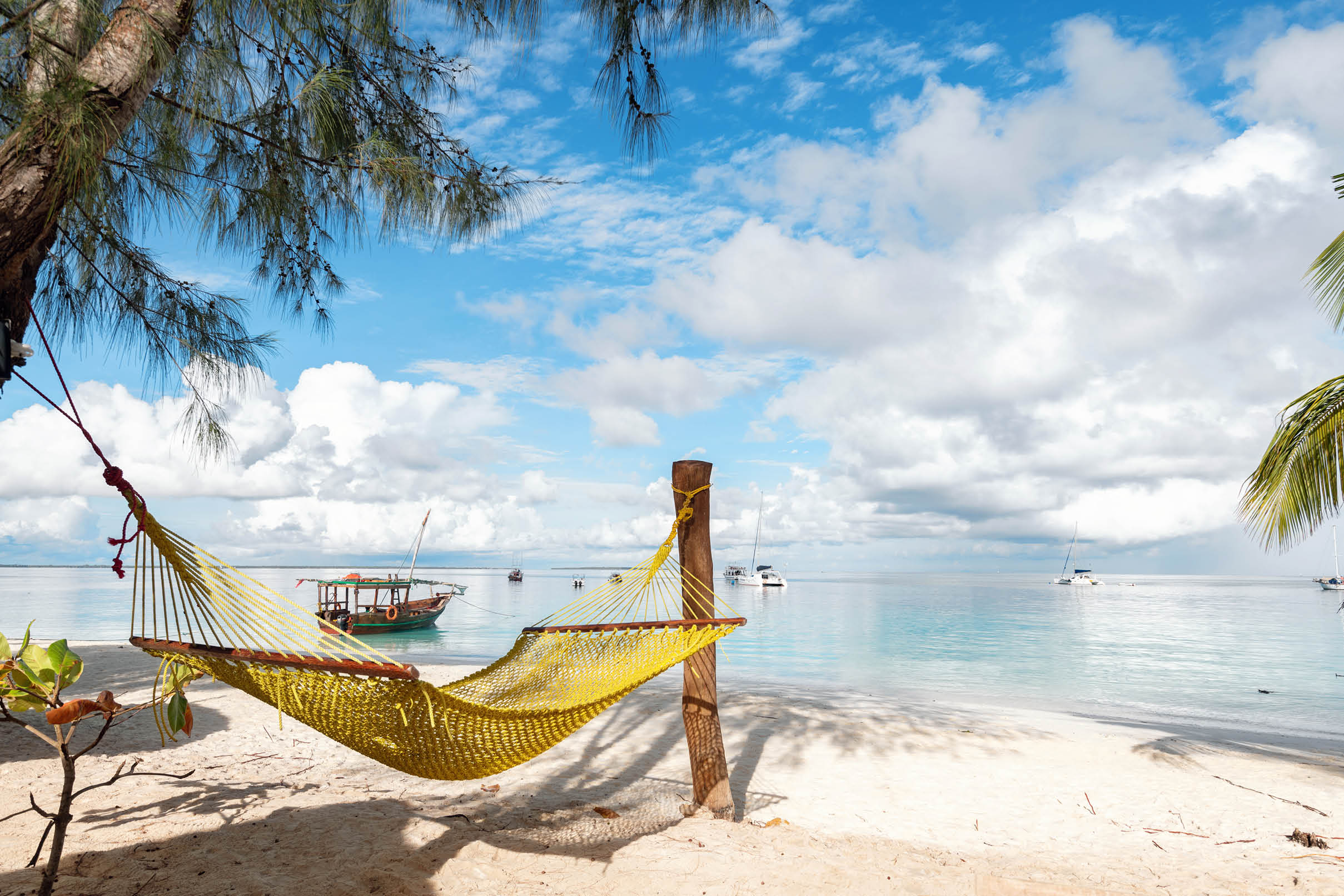 Yellow hammock on idyllic beach of zanzibar
