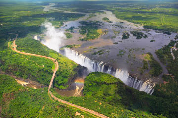 Victoria Falls (or Mosi-oa-Tunya (Tokaleya Tonga: the Smoke that Thunders) is a waterfall in southern Africa on the Zambezi River at the border of Zambia and Zimbabwe.