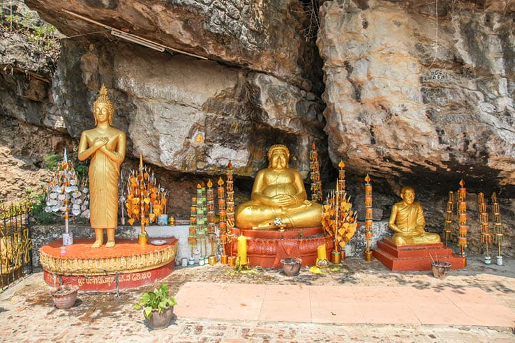 Golden buddha statues in a shrine on Mount Phousi in Laung Prabang - Laos