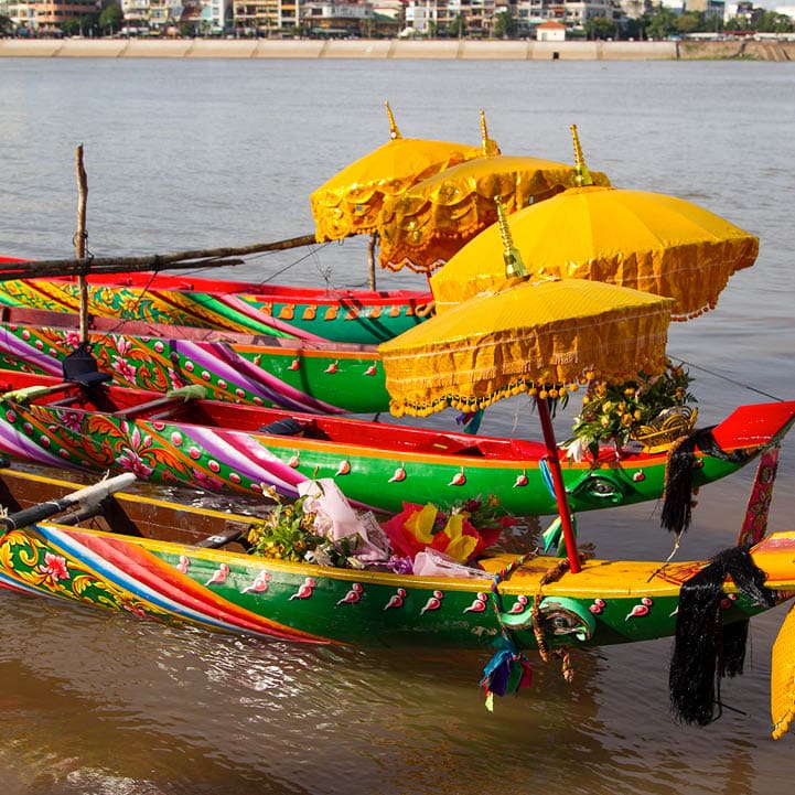 Racing boats with traditional decoration at the Water Festival in Phnom Penh, Cambodia in 2010.