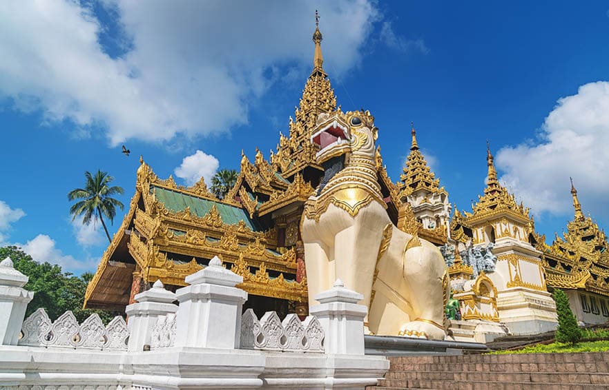 Golden ornamental south entrance gate with huge dragon statues to the famous Shwedagon Pagoda (Stupa) in downtown Yangon (Rangoon), Myanmar, Asia