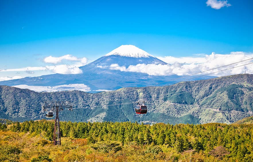 Ropeway and view of Mountain Fuji from Owakudani, Hakone. Japan.