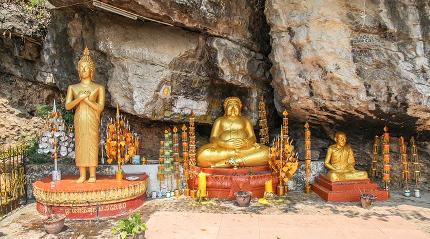 Golden buddha statues in a shrine on Mount Phousi in Laung Prabang - Laos
