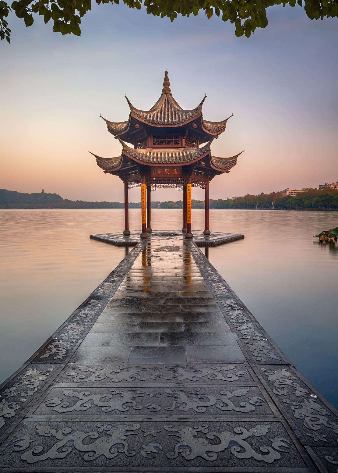 illuminated ancient Jixian Pavilion at West Lake, Hangzhou, China. All Chinese words only introduce itself which means Jixian Pavilion without advertisement.