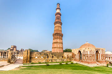 Qutub Minar Complex and Qutab Minaret Tower. The Qutub Minar was constructed in the year 1192 out of red sandstone and marble.Is the tallest minaret in India, with a height of 72.5 meters (237.8 feet). Qutub Minar, Delhi, India.