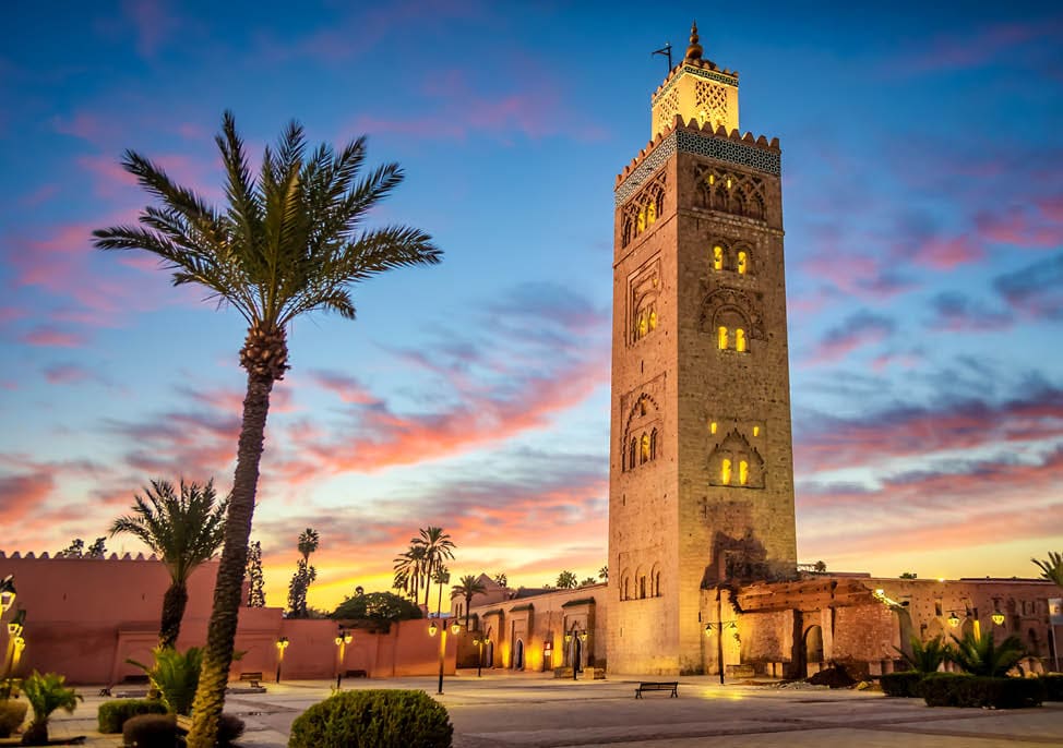 Koutoubia mosque in the morning surrounded by palm tree, Marrakesh, Morocco