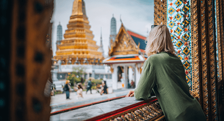 Young woman exploring Grand Palace and Wat Phra Kaew in Bangkok, Thailand