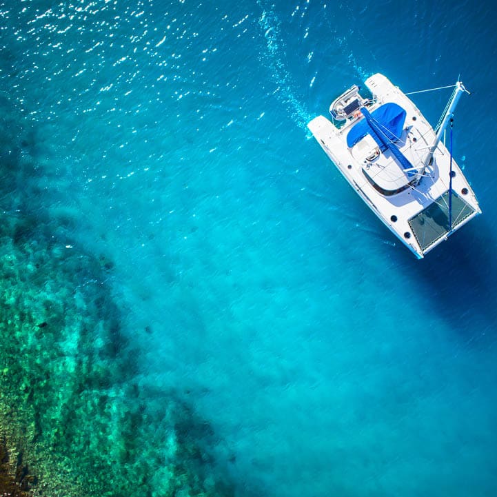 Amazing view to Catamaran in open sea at windy day