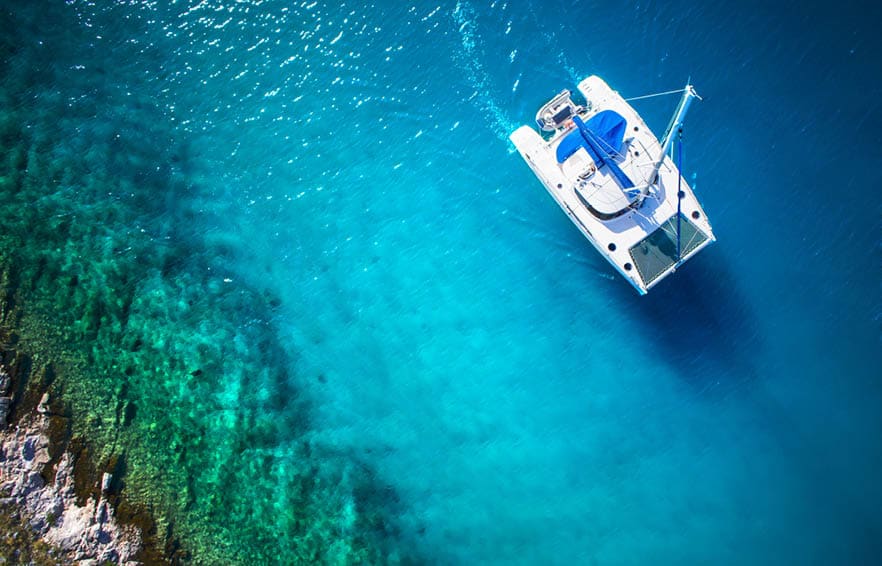Amazing view to Catamaran in open sea at windy day