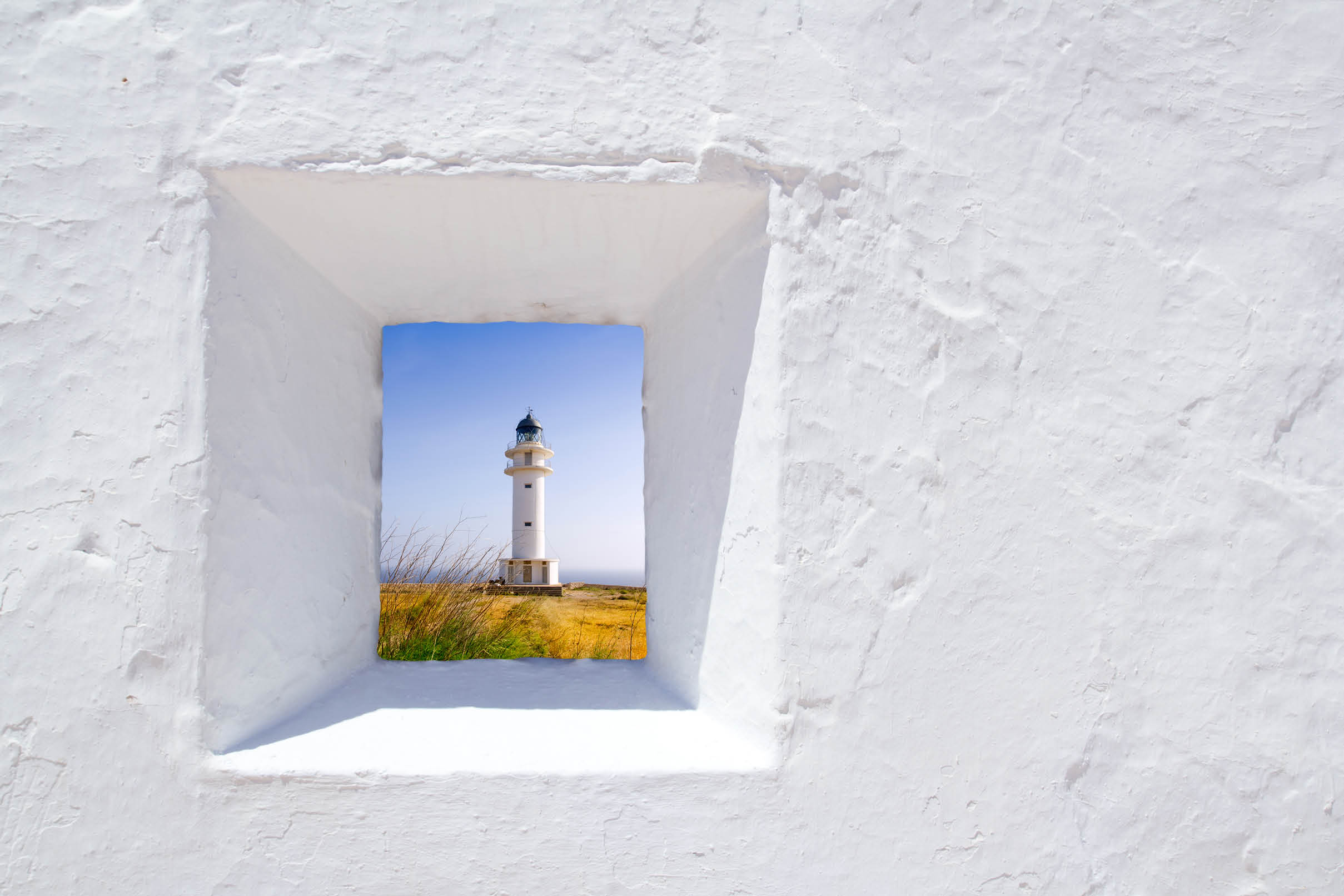 Formentera mediterranean white window with Barbaria lighthouse