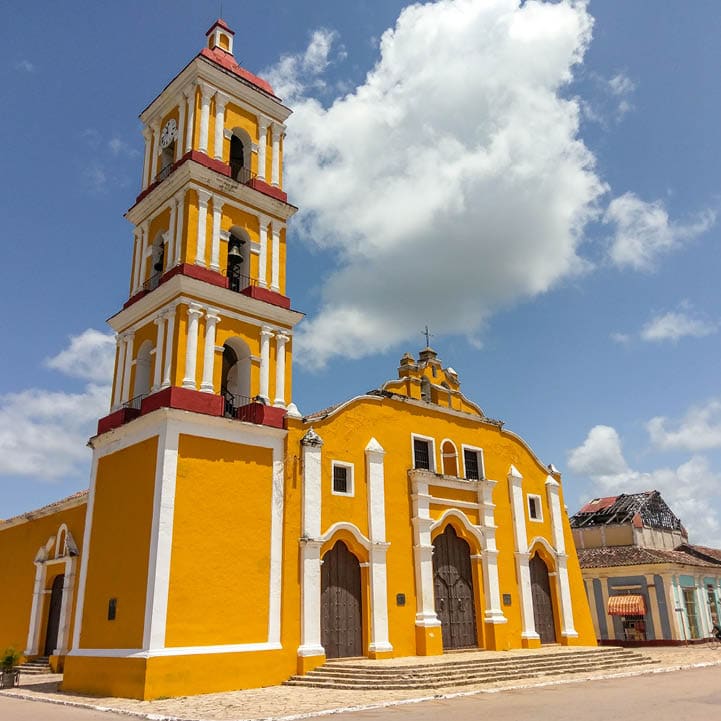 Yellow colonial style church of Iglesia Major in the city of Remedios, Cuba