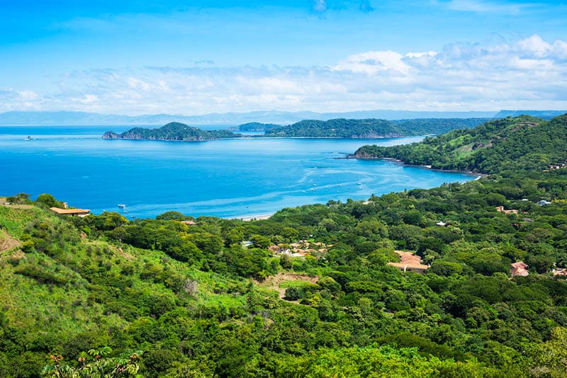 A photograph of the small town of Playa Hermosa, Guanacaste, Costa Rica, in Central America. Over looking the Golfo Papagayo and the Pacific Ocean