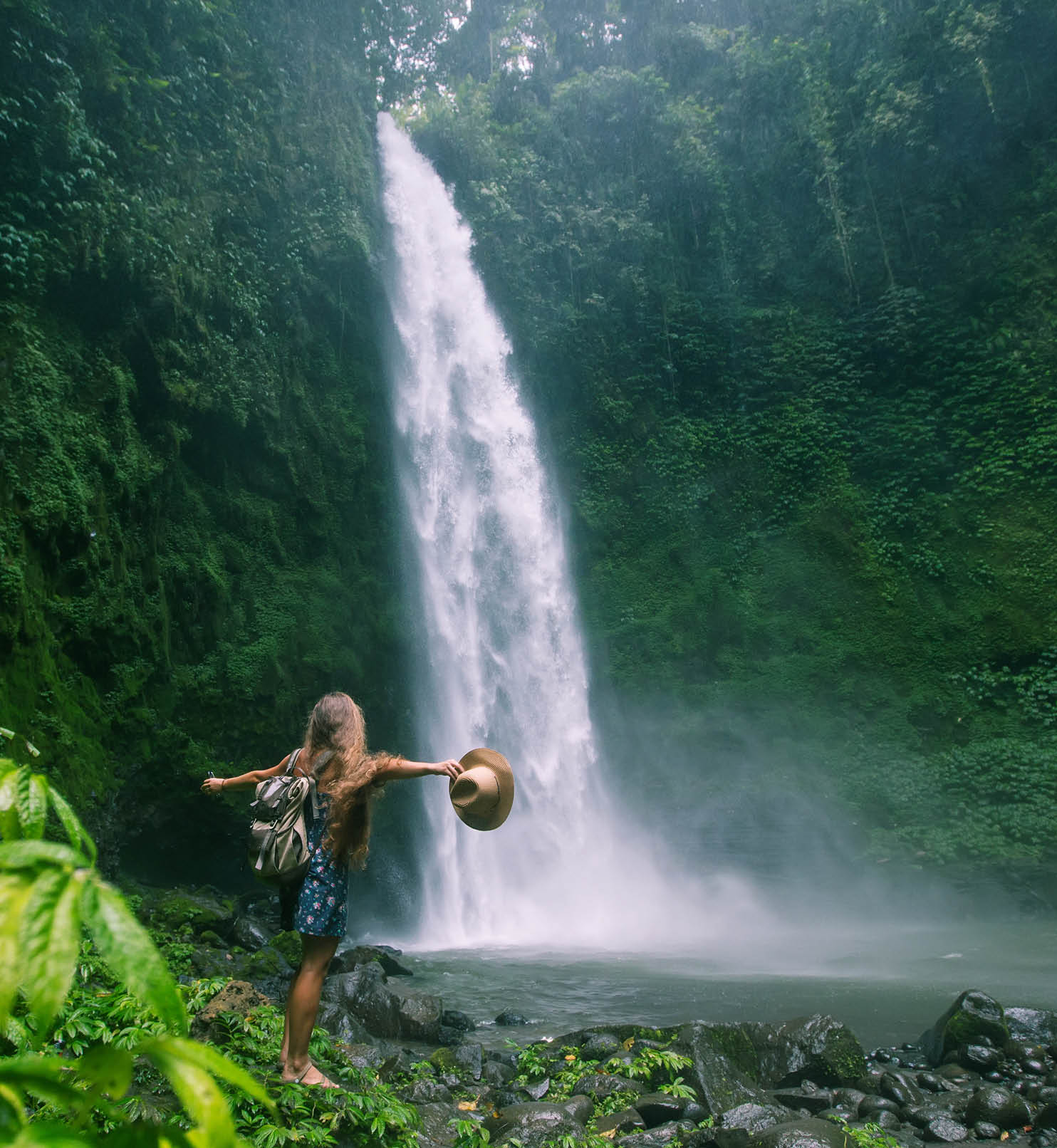 Woman near Nung Nung waterfal on Bali, Indonesia