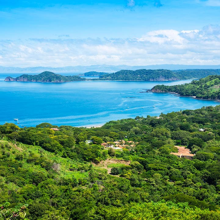 A photograph of the small town of Playa Hermosa, Guanacaste, Costa Rica, in Central America. Over looking the Golfo Papagayo and the Pacific Ocean