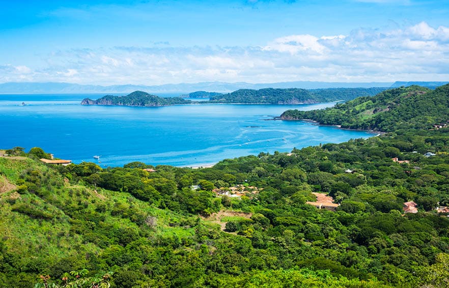 A photograph of the small town of Playa Hermosa, Guanacaste, Costa Rica, in Central America. Over looking the Golfo Papagayo and the Pacific Ocean