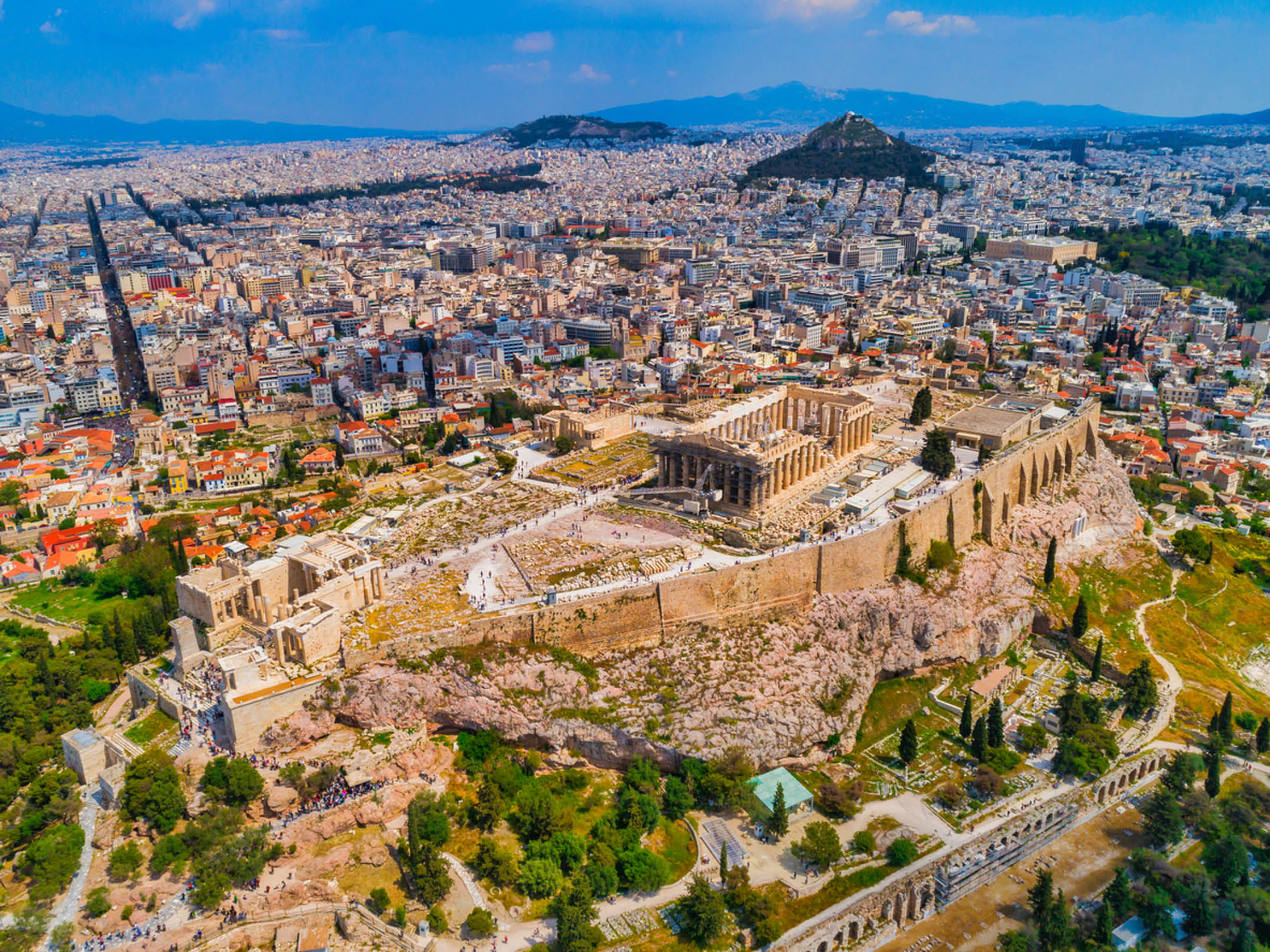 Aerial view of the ruins of the Acropolis and the skyline of Athens, on a sunny summer day, Greece