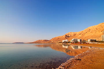 Coast of the Dead Sea with hotels against mountains