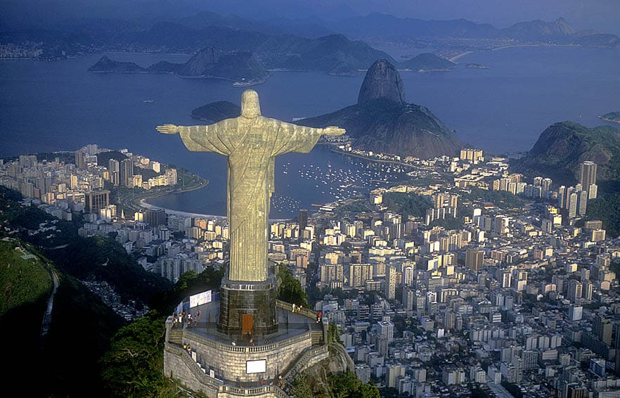 Rio de Janeiro, RJ, Brazil: Aerial view of Christ, symbol of Rio de Janeiro, standing on top of Corcovado Hill, overlooking Guanabara Bay