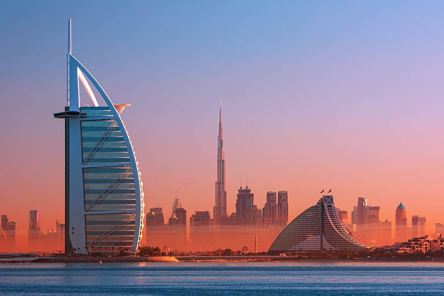 Dubai city - amazing city center skyline and famous Jumeirah beach at sunset, United Arab Emirates