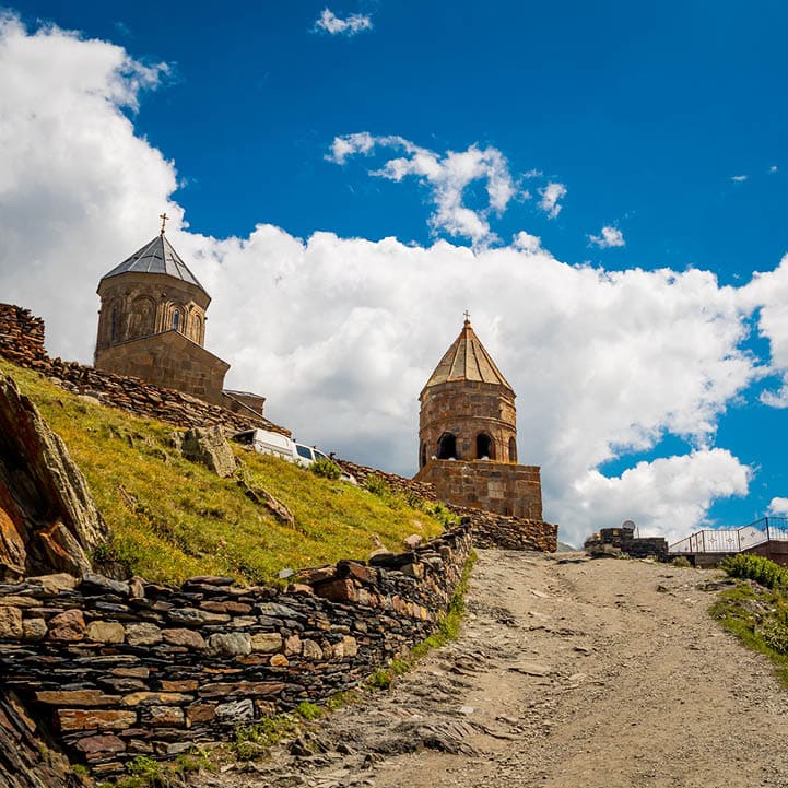 Gergeti Trinity Church (Tsminda Sameba) in Kazbegi, Georgia. The Church near the village of Gergeti, under Mount Kazbegi in summer 