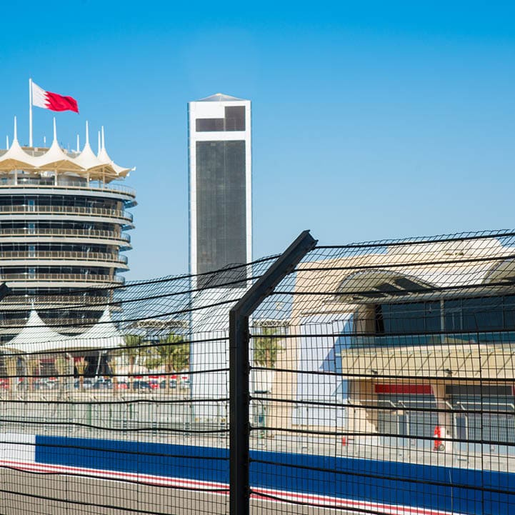 Gate at the Pit Lane of Bahrain International Circuit, open-wheel single-seater racing car Racing Track. Control Tower with Bahrain Flag. Kingdom of Bahrain, Middle East.