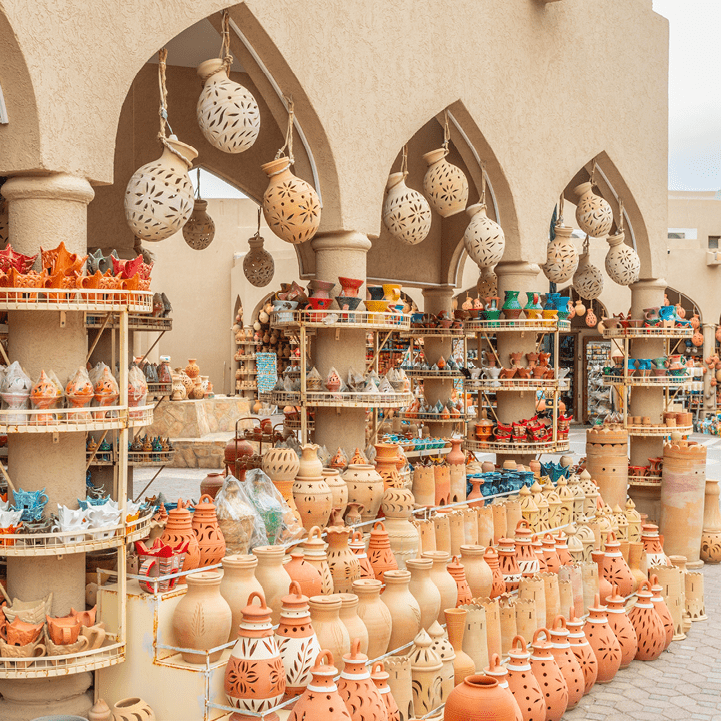 Handmade souvenirs and ceramic pottery jugs trade market in bazaar of Nizwa, Sultanate Oman