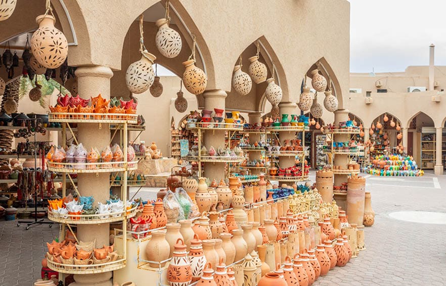 Handmade souvenirs and ceramic pottery jugs trade market in bazaar of Nizwa, Sultanate Oman