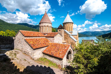 Ananuri in Georgia, fortress with orthodox monastery and reservoir on a hill over water reservoir 