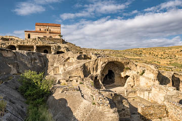 Uplistsikhe cave town near Gori city in Georgia. Ancient cave city Uplistsikhe at sunset in Georgia, UNESCO site.