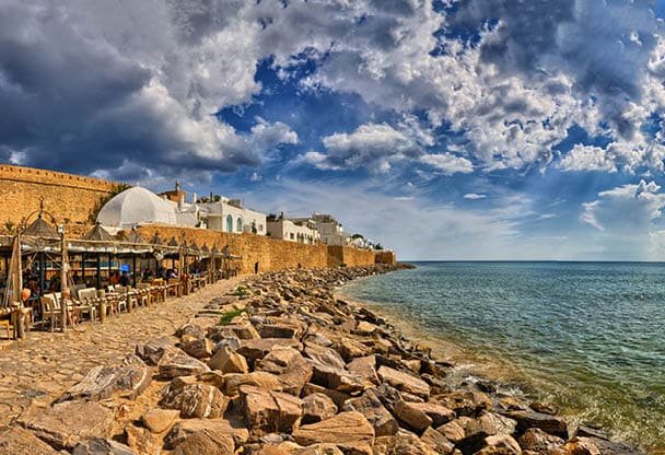 HAMMAMET, TUNISIA - OCT 2014: Cafe on stony beach of ancient Medina on October 6, 2014 in Hammamet, Tunisia
