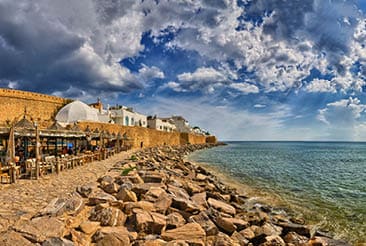 HAMMAMET, TUNISIA - OCT 2014: Cafe on stony beach of ancient Medina on October 6, 2014 in Hammamet, Tunisia