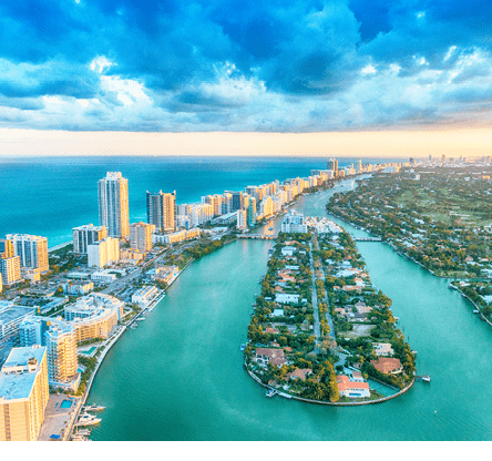 Miami Beach, wonderful aerial view of buildings, river and vegetation.