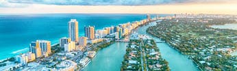 Miami Beach, wonderful aerial view of buildings, river and vegetation.