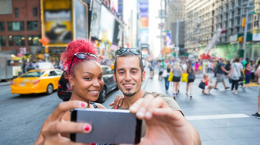 Young Couple Taking Selfie in Times Square