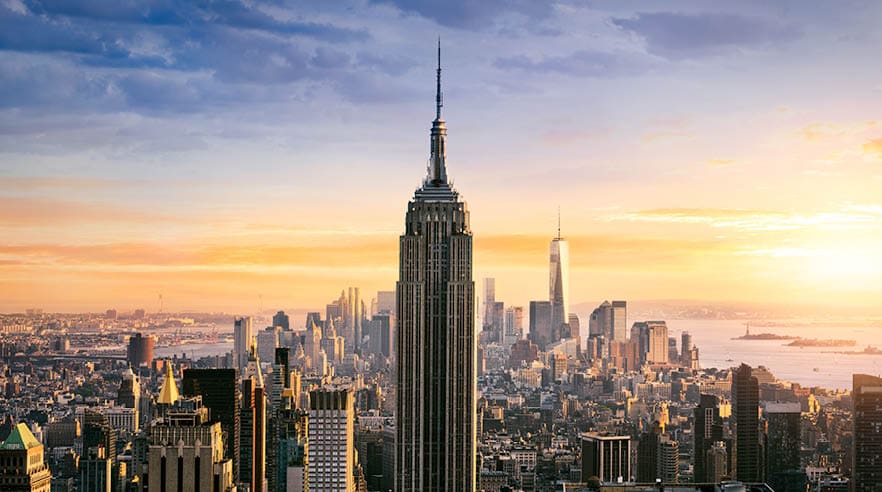 New York City skyline with urban skyscrapers at sunset, USA.
